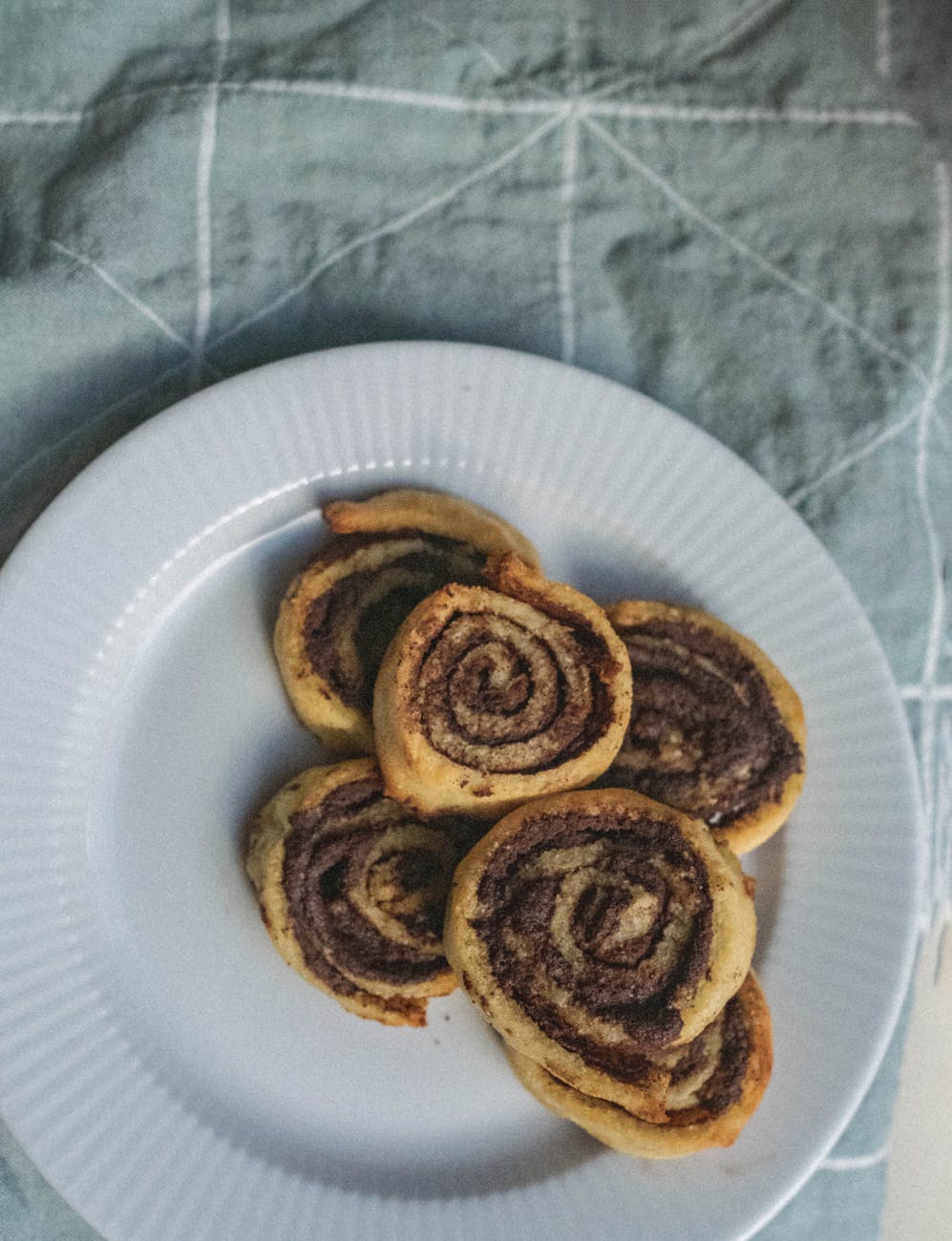 cinnamon rolls on white plate